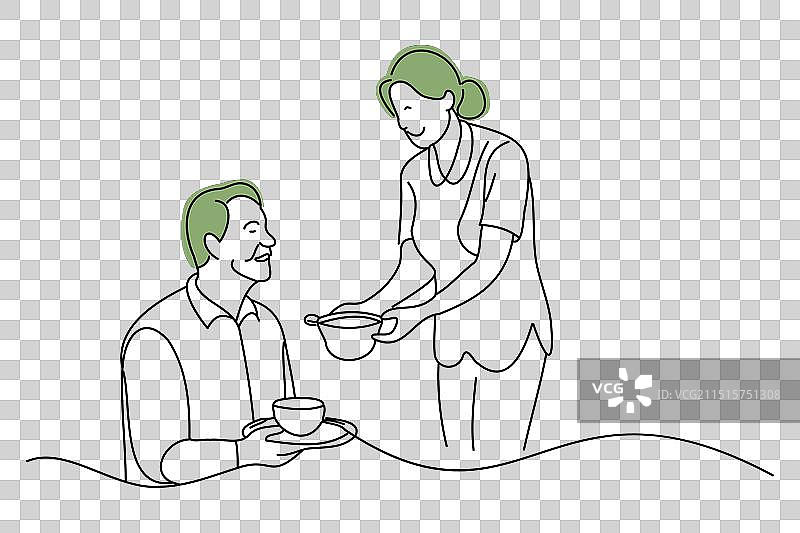 护理人员协助老人用餐图片素材