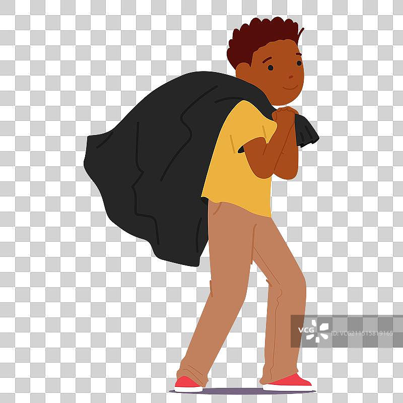 快乐的儿童拖着黑色麻袋图片素材