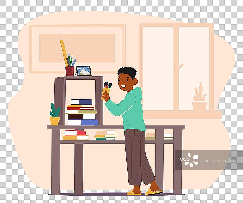 男孩整理书籍和文具图片素材