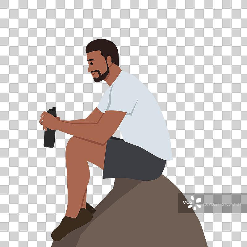 年轻的徒步旅行者坐在山崖上图片素材