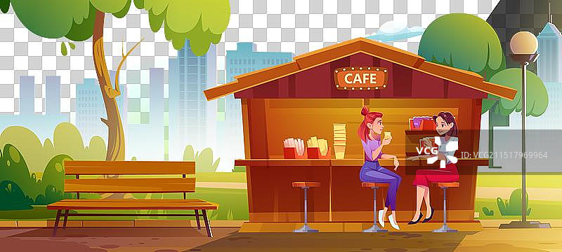 女人坐在城市公园的街边咖啡馆图片素材