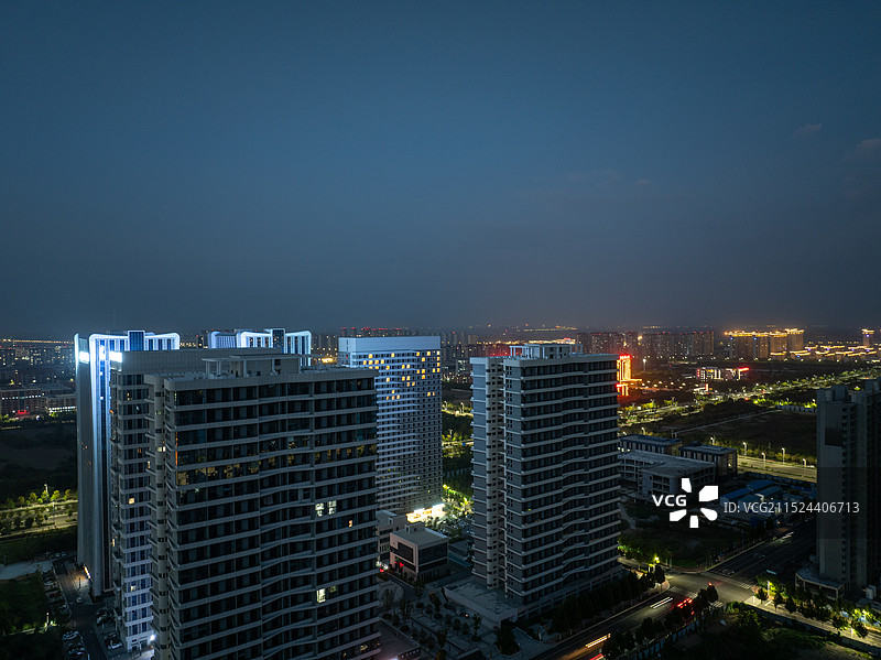 周口东新区文昌大道商务区建筑城市天际线夜景图片素材
