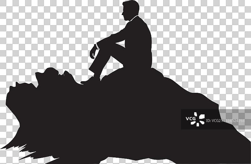 岩石露头上男人的平静安宁场景图片素材