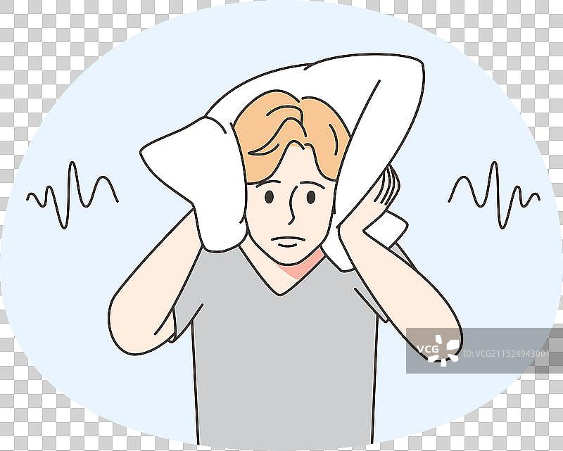 男人用枕头捂住耳朵图片素材