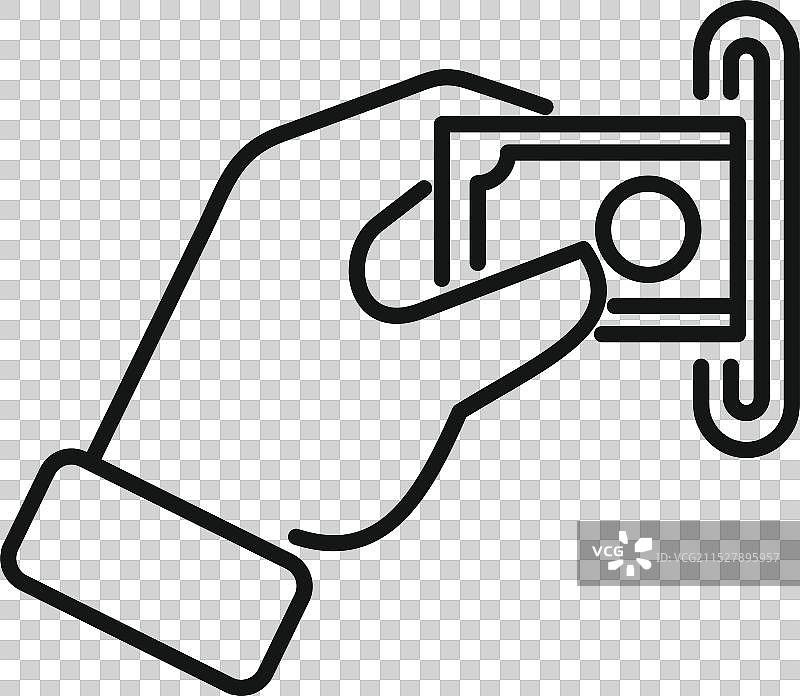 商人手中将钞票插入自动取款机图片素材