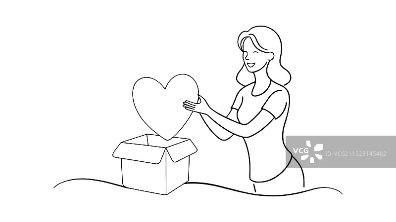 女人快乐地打开一个盒子，里面露出一个心形物体图片素材