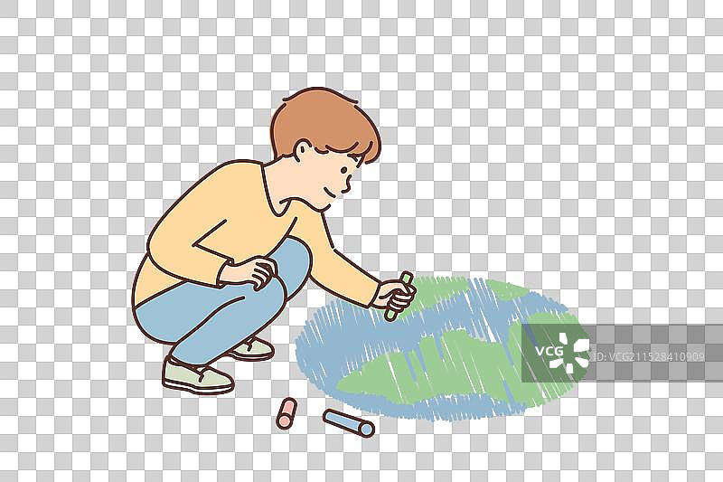 微笑的男孩在地上画行星图片素材