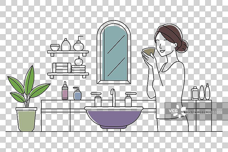 一位女性专注于使用面部清洁剂图片素材