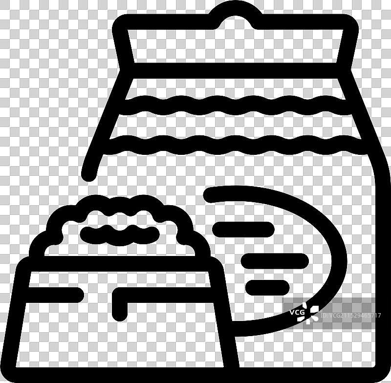 打开的面粉或糖袋，旁边有一个勺子图片素材