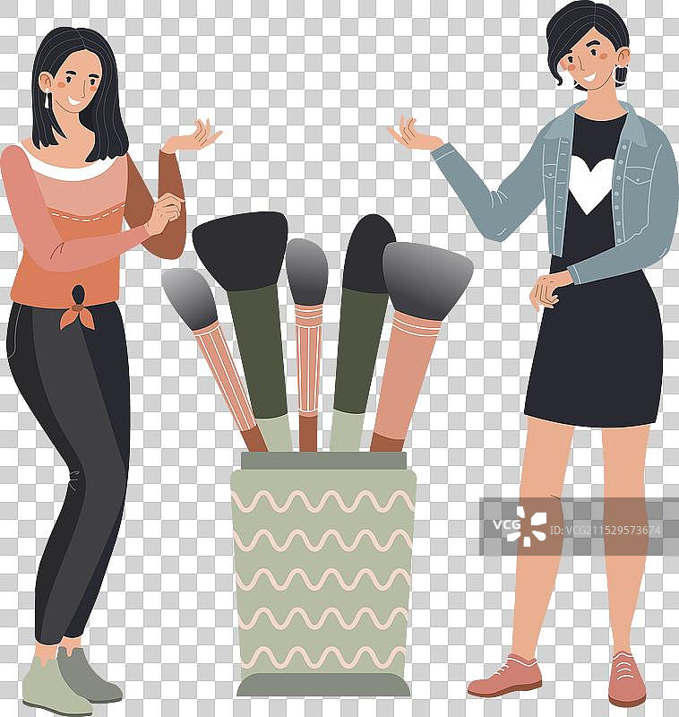 两位年轻女性展示化妆刷图片素材