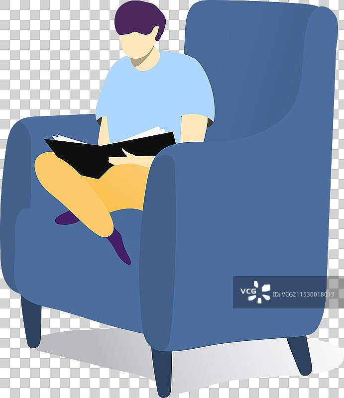 年轻男性坐在蓝色扶手椅上阅读一本书图片素材