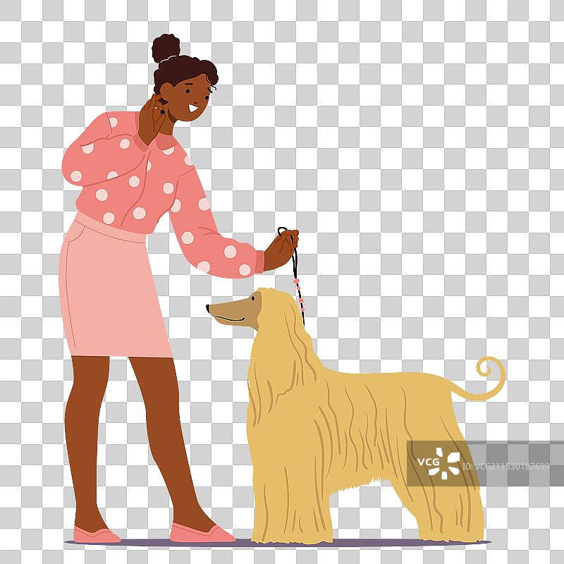 女性在宠物展会上展示一只狗图片素材