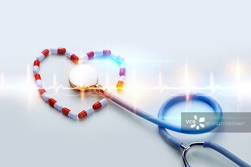 胶囊药组成的心形和听诊器心电图图片素材