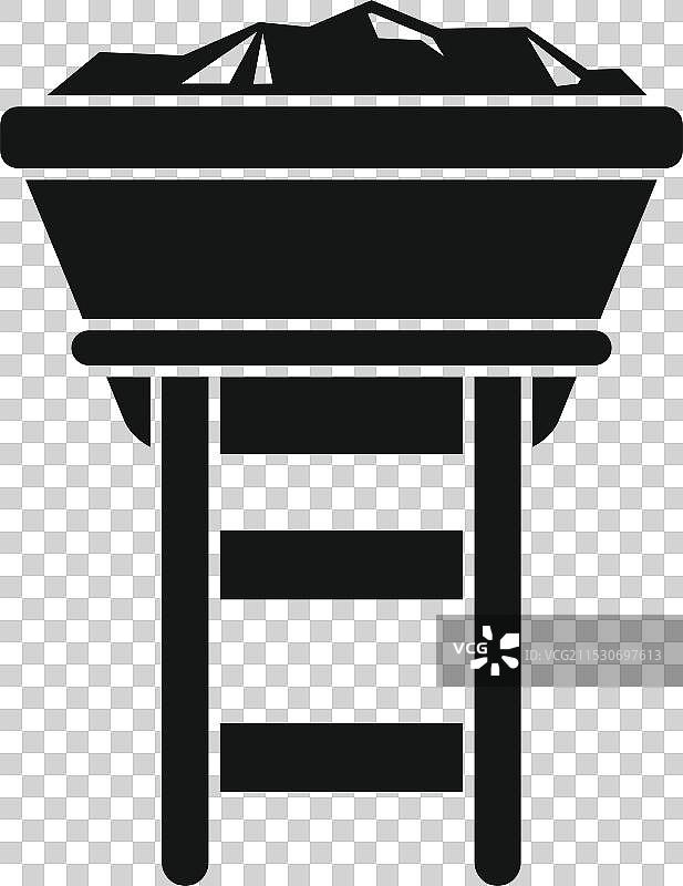 装满煤炭的矿车停在木架上图片素材