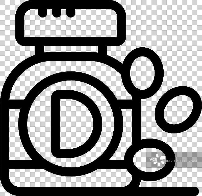 黑色背景下的维生素D瓶子，药丸洒落一地图片素材