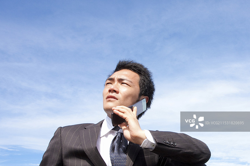 商人正在用手机通话图片素材