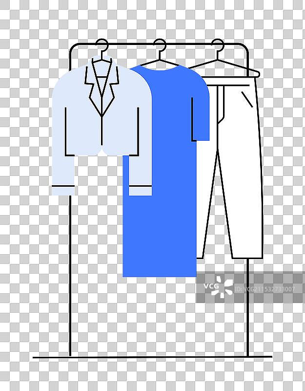 优雅的衣架，上面挂着衬衫裙和裤子图片素材