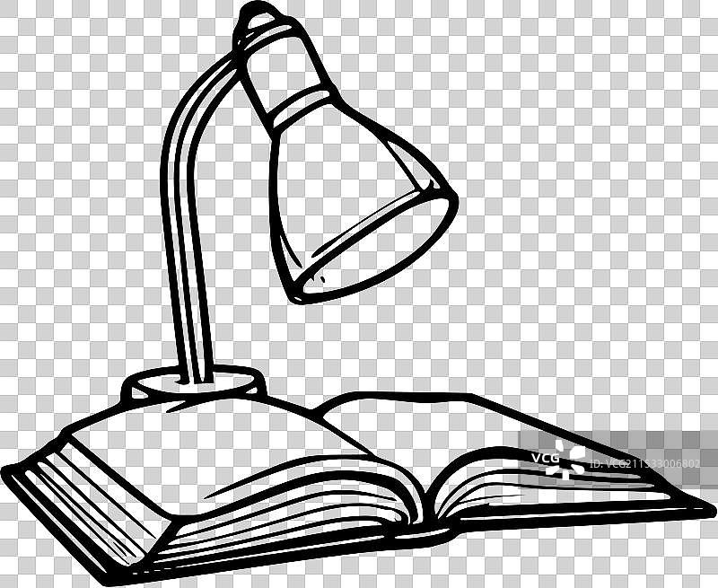 学习台灯下的打开书籍图片素材