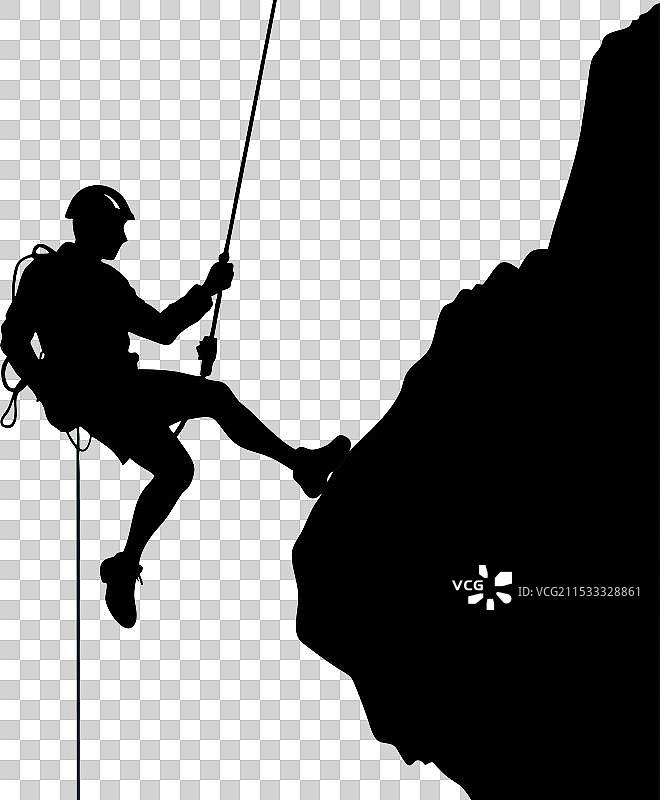 攀登者在陡峭岩壁上攀爬的剪影图片素材