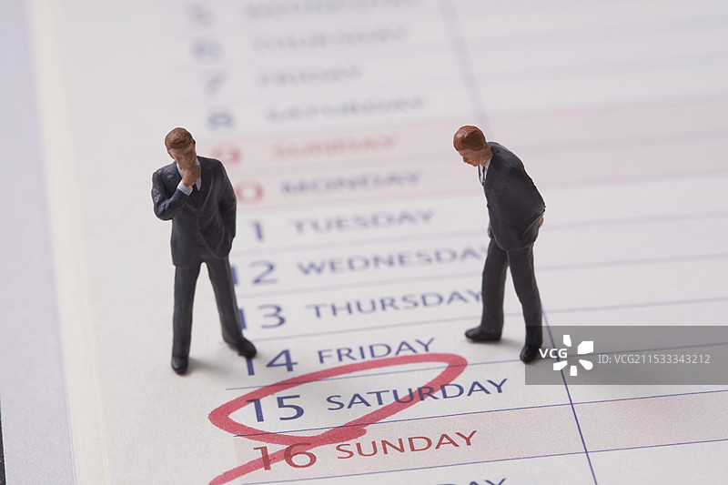 迷你商人玩偶和日程本图片素材
