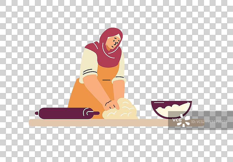 一位戴着头巾的女性在揉面图片素材