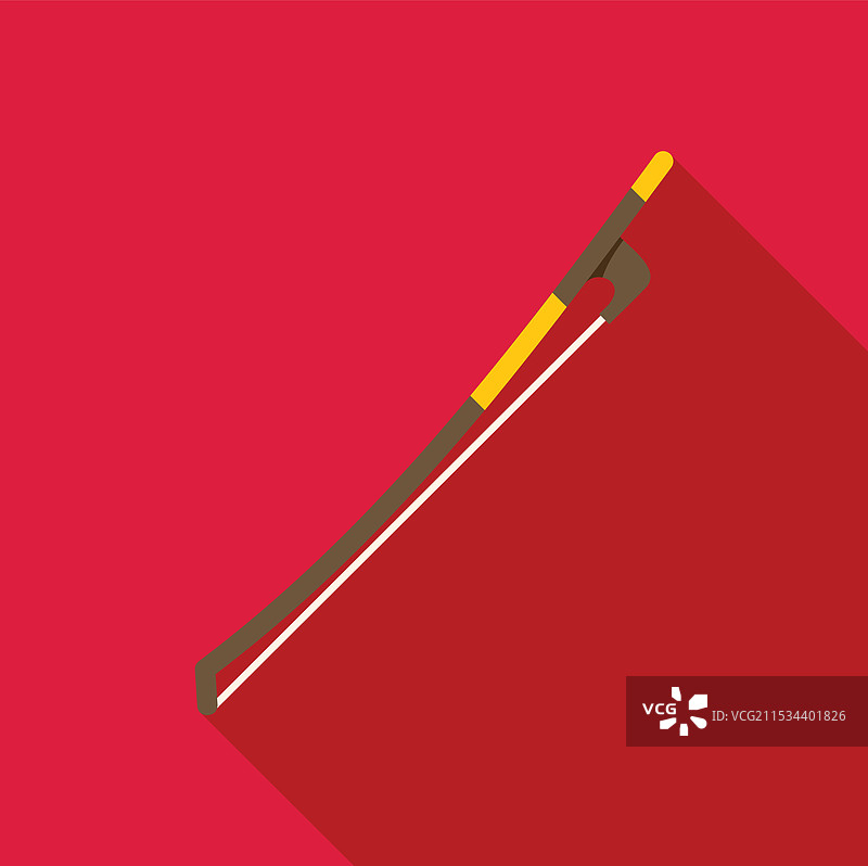 小提琴弓放在鲜艳的红色背景上图片素材