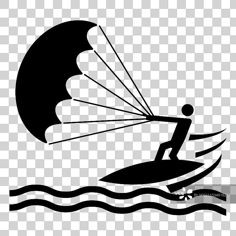 冲浪者在日落时分与滑翔伞一起骑浪图片素材