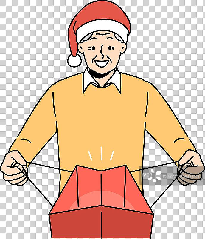 戴着圣诞老人帽的老年男子打开包裹图片素材