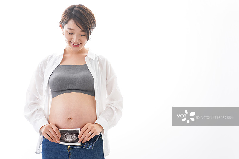 年轻孕妇与超声图像图片素材