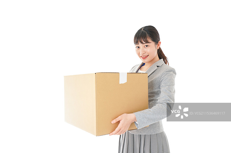 年轻女商人提着行李图片素材