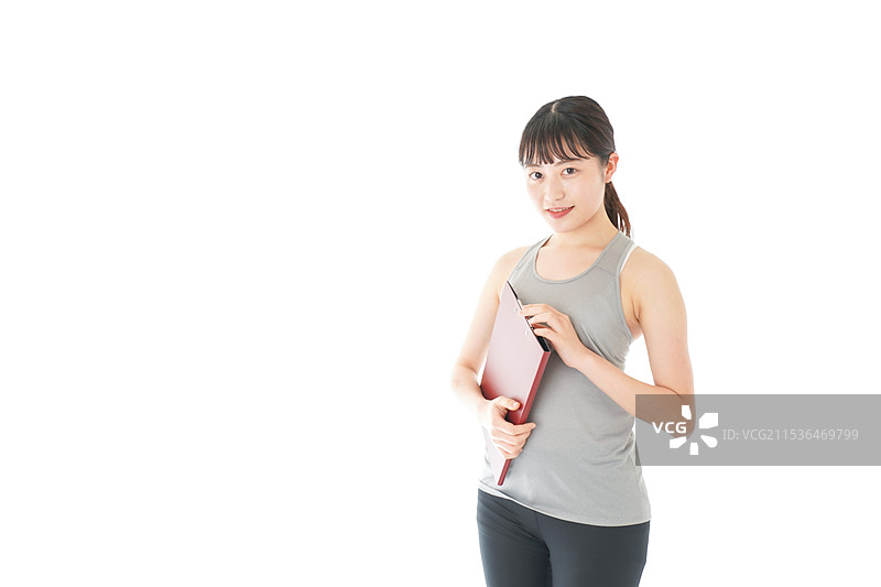 年轻女性穿着运动服图片素材