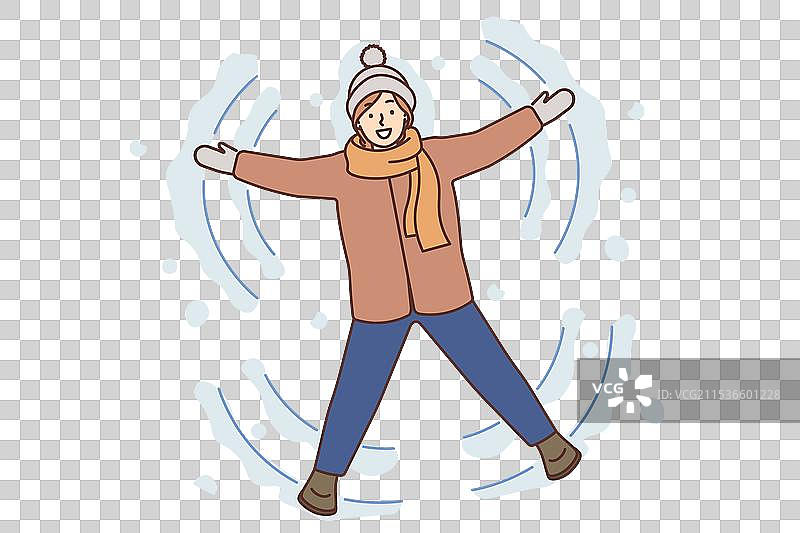 微笑的女孩在冬天的地面上做雪天使图片素材