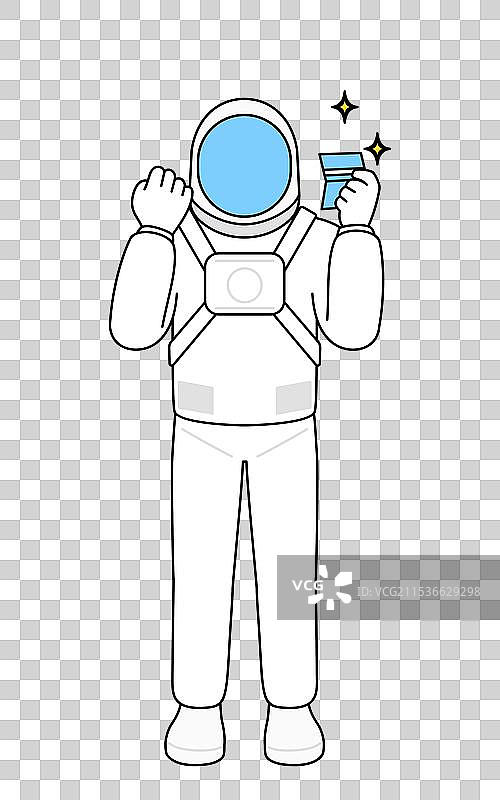 看到存折的宇航员感到高兴图片素材