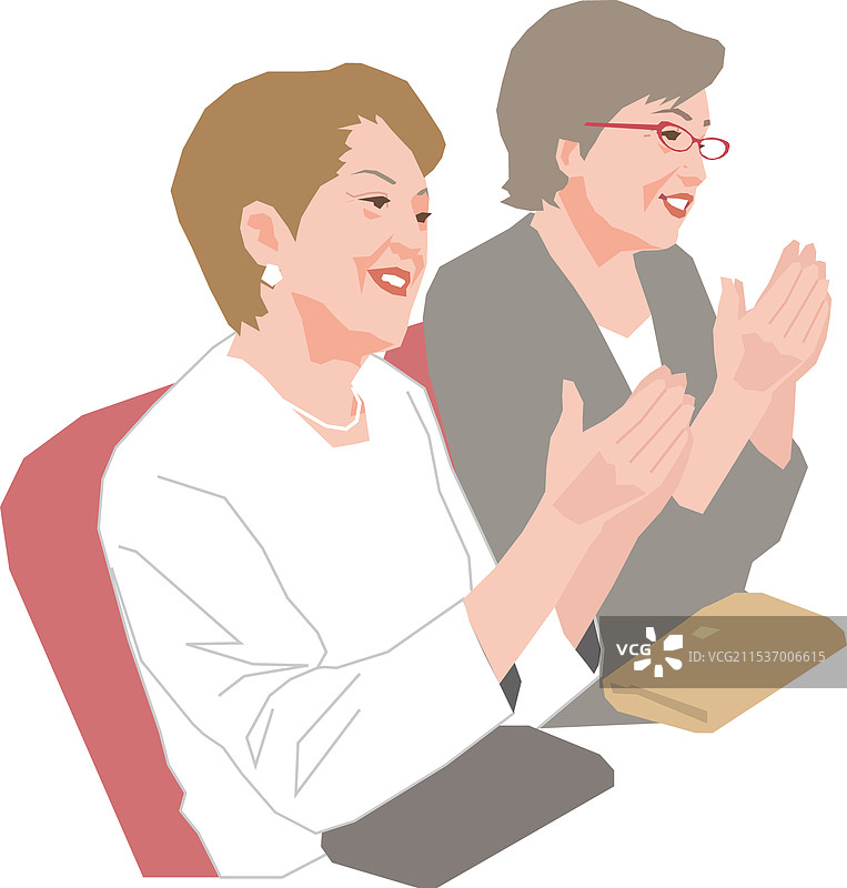 活跃的老年女性在剧院中鼓掌图片素材