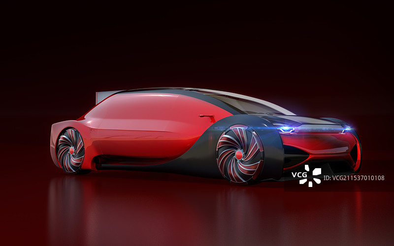 一辆金属红色的自动电动豪华轿车，背景为黑色，设计独特。图片素材