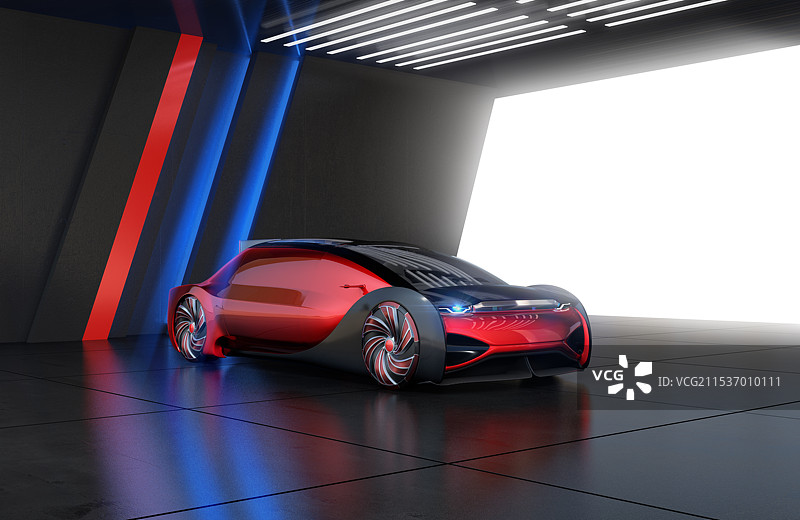 现代停车场停放着一辆金属红色的豪华自动电动轿车图片素材