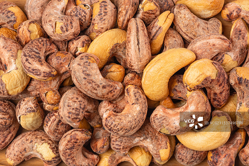 高清紫衣腰果仁满铺背景图片素材