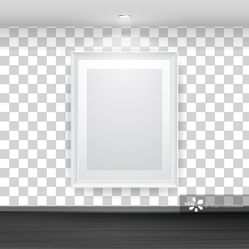 空白的白色相框挂在黑色墙壁上图片素材