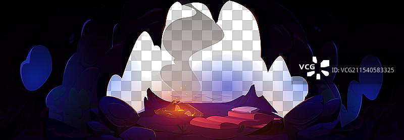 黑暗的洞穴里有睡袋和篝火图片素材