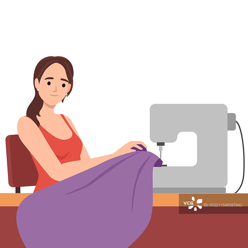 年轻女性坐在桌子旁缝纫图片素材