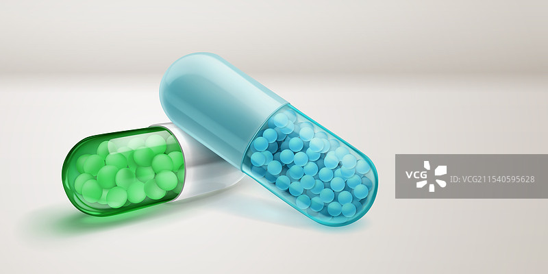 绿色和蓝色的胶囊，里面装有小药丸图片素材