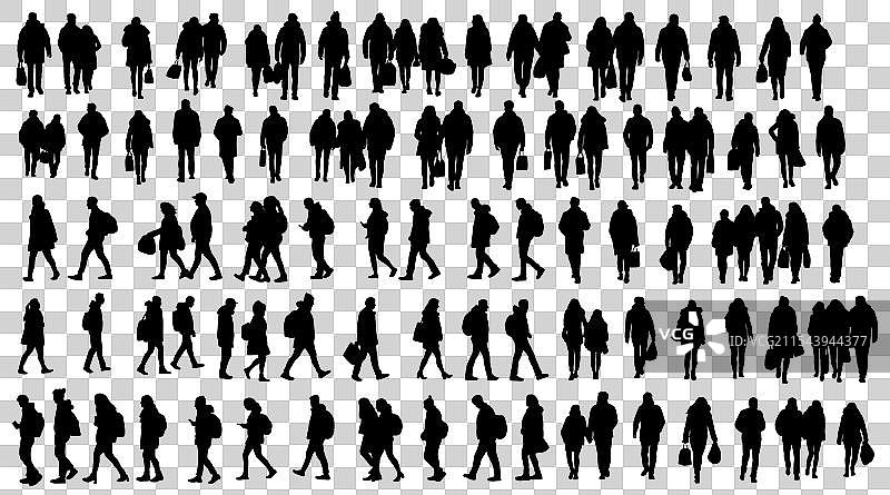 人们在街上行走，人们在斑马线上穿行。图片素材