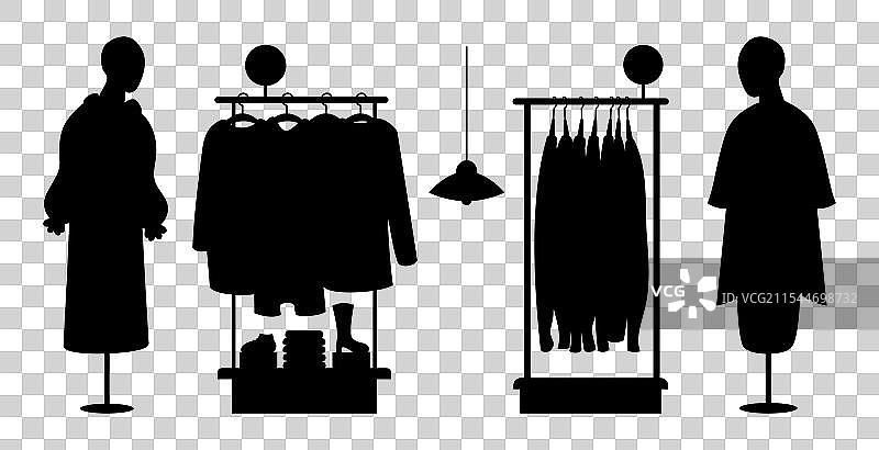 购物商店的衣架上挂着衣服和模特图片素材