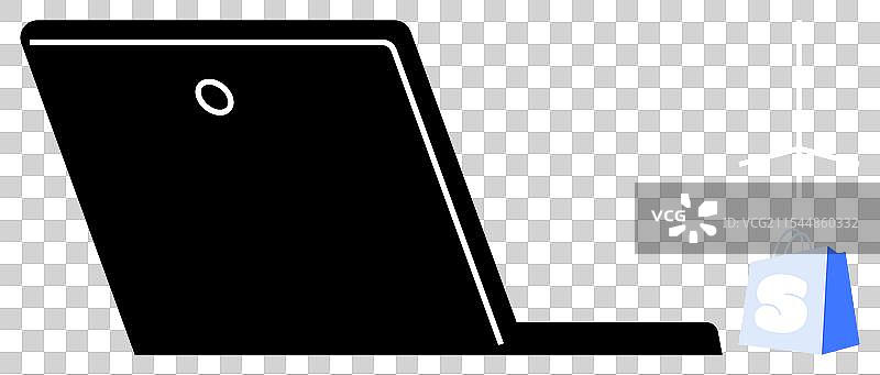 打开的笔记本电脑与购物袋的剪影图片素材