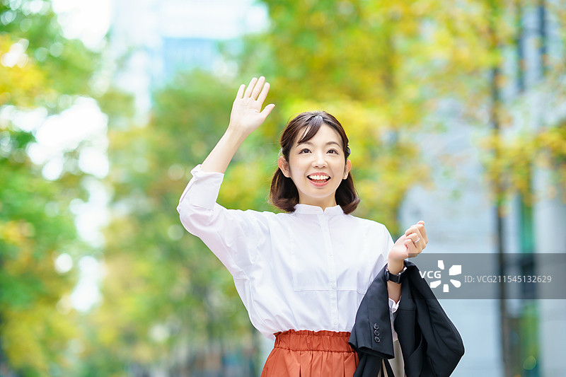 女商人挥手致意图片素材