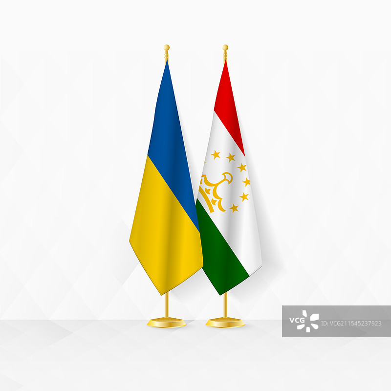 乌克兰和塔吉克斯坦国旗在旗杆上展示图片素材