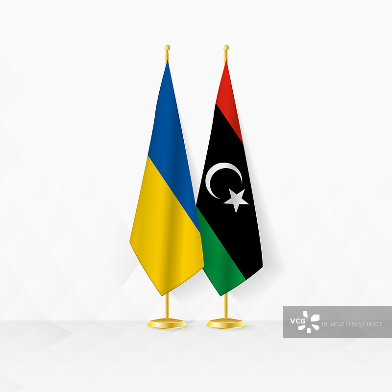 乌克兰和利比亚国旗在旗杆上的展示图片素材