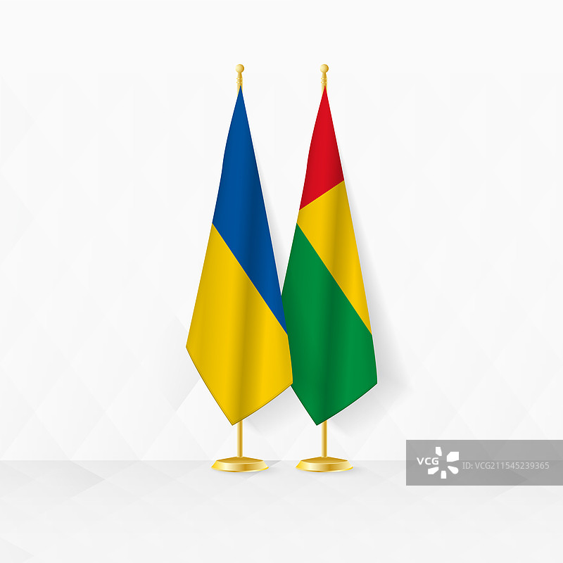 乌克兰和几内亚比绍的国旗在旗杆上展示图片素材