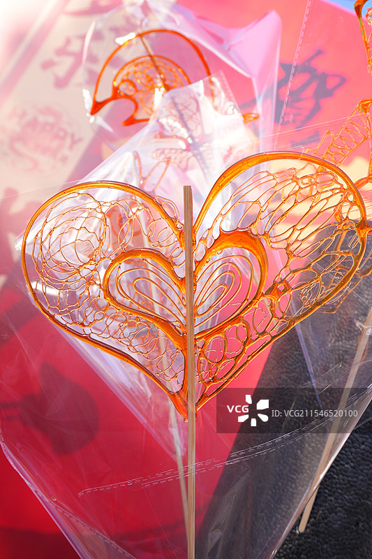 心形、蛇形、爱心形糖画糖人图片素材