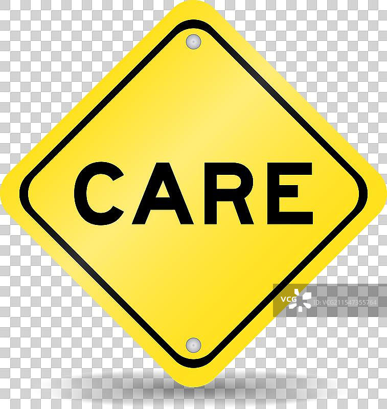 黄色交通标志，上面写着“注意”图片素材